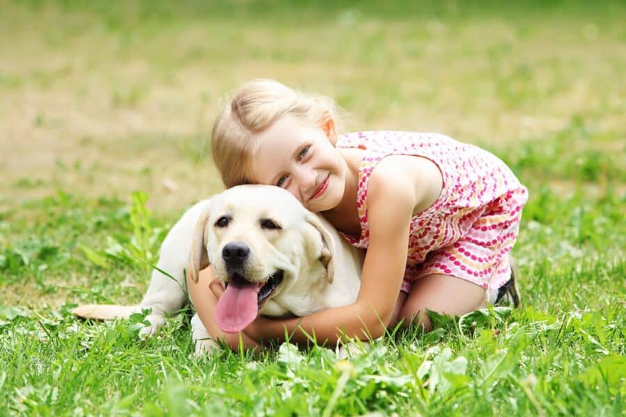 girl with a blonde yellow lab